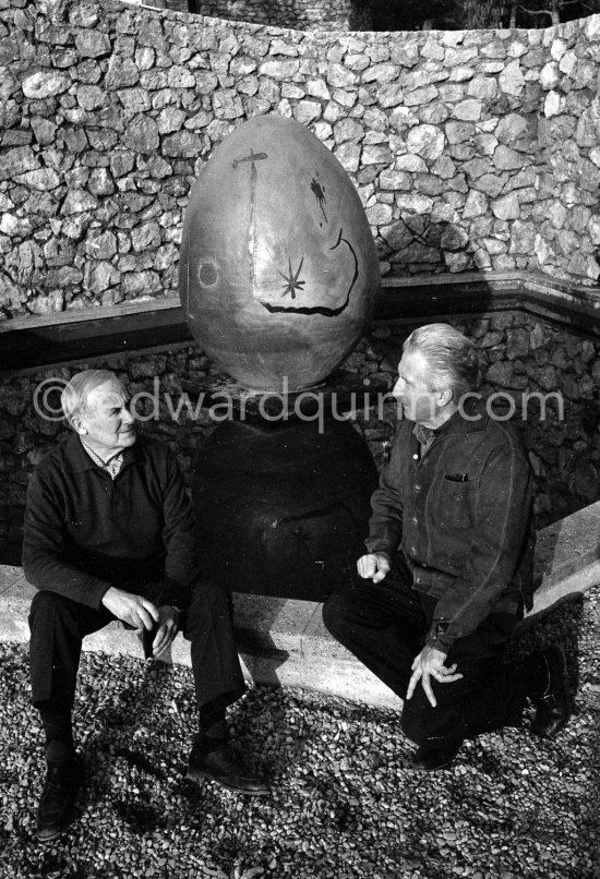 Joan Miró and Aimé Maeght in the gardens of Musée Maeght in front of a small pool with an "Oeuf cosmique" by Miró in center. Saint-Paul-de-Vence 1964. - Photo by Edward Quinn