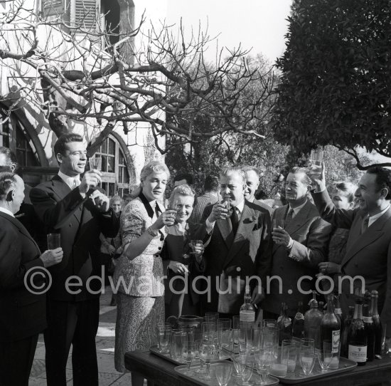 Simone Signoret, French actress often hailed as one of France’s greatest movie stars, on her wedding in 1951 to actor and singer Yves Montand. With Jacues Prévert and his wife. At the same restaurant Colombe d’Or, Saint-Paul-de-Vence, where their romance began. - Photo by Edward Quinn