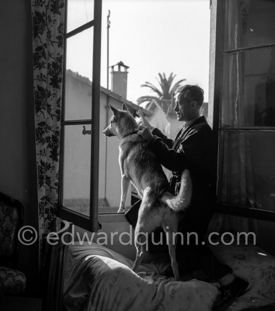 French explorer Michel Perrin, who sought the source of the Amazon, with his German Shepherd Dog Fido. Golfe-Juan 1953. - Photo by Edward Quinn