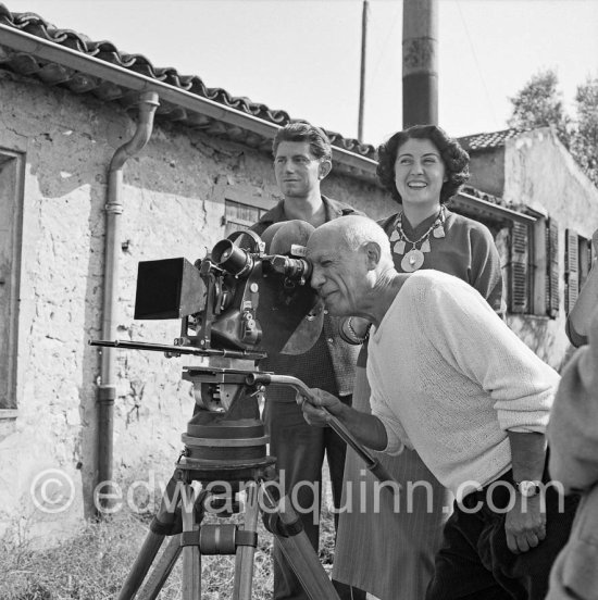 Pablo Picasso checking a camera angle (documentary film of Luciano Emmer). With Paulo Picasso and Madame Paule de Lazerme (she had an affair with Pablo Picasso for some months) who wears a necklace designed by Pablo Picasso. In front of the studio Le Fournas, Vallauris 1953. Jaeger-LeCoultre Triple Date Moonphase - Photo by Edward Quinn