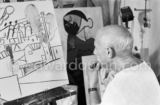 Pablo Picasso doing a charcoal drawing of the view from Le Fournas during filming of Luciano Emmer\'s documentary. Vallauris 26.6.1953. - Photo by Edward Quinn