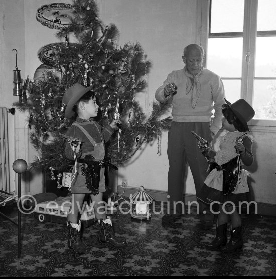 Pablo Picasso with Paloma Picasso and Claude Picasso. Christmas at La Galloise, Vallauris 1953. - Photo by Edward Quinn