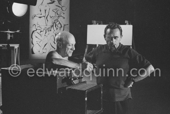 Pablo Picasso working on a bucolic pastoral scene on drawing paper which was to serve as background for the film "Le mystère Picasso" by Henri-Georges Clouzot. Nice, Studios de la Victorine 1955. - Photo by Edward Quinn