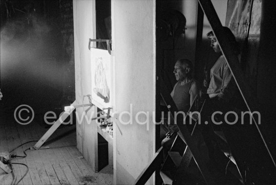 "Le mystère Picasso". Pablo Picasso working on corrida painting. With Maya Picasso. Nice, Studios de la Victorine, 1955. - Photo by Edward Quinn