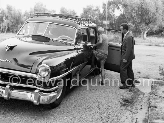 Pablo Picasso leaving the Studios de la Victorine on the occasion of the filming of "Le mystère Picasso". Nice 1955. Car: Chrysler Windsor 1951 Eight Passenger Sedan - Photo by Edward Quinn