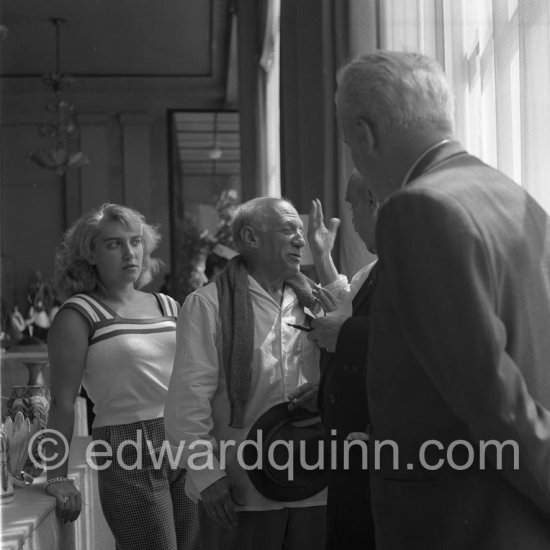 Pablo Picasso and Maya at the "Exposition Internationale Céramique". On the right Manuel Gonzalez Marti, director of the Museo de Bellas Artes de Valencia. Cannes 1955. - Photo by Edward Quinn