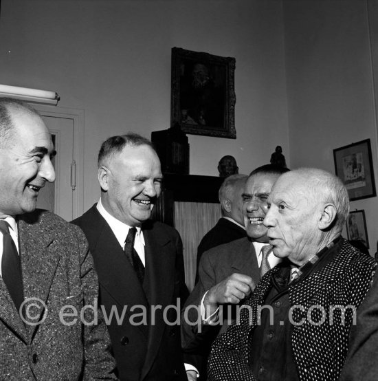 Pablo Picasso at a private viewing of his book illustrations in the Matarasso gallery in Nice. With Laurent Casanova, Maurice Thorez, Henri Matarasso. "Pablo Picasso. Un Demi-Siècle de Livres Illustrés". Galerie H. Matarasso. 21.12.1956-31.1.1957. Nice 1956. - Photo by Edward Quinn