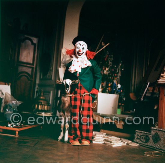 Claude Picasso dressed up as a clown. With goat Esmeralda. La Californie, Cannes 1956. - Photo by Edward Quinn