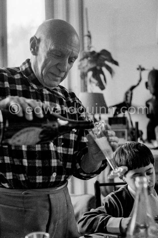 Pablo Picasso and Claude Picasso at Christmas. La Californie, Cannes 1956. - Photo by Edward Quinn