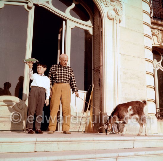 Pablo Picasso at Christmas with Esmeralda, the goat he received from Jacqueline. Claude Picasso with his Christmas present, a toy Citroën DS. La Californie, Cannes 1956. - Photo by Edward Quinn