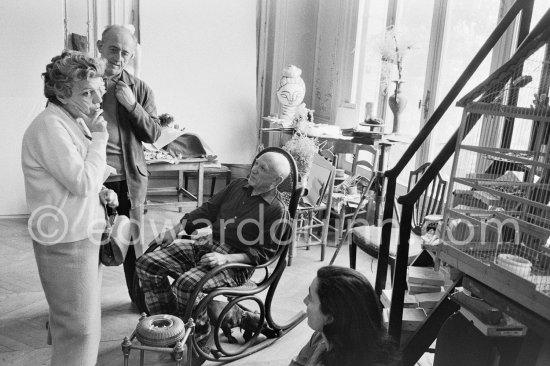 Pablo Picasso showing Suzanne and George Ramié wood sculptures "The Bathers (Les Baigneuses)". On the right Jacqueline. Birdcage. La Californie, Cannes 1957. - Photo by Edward Quinn