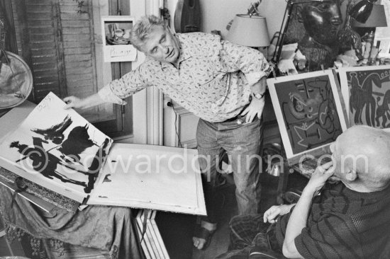 Pablo Picasso showing an India ink bullfight drawing to Edouard Pignon. La Californie, Cannes 1959. - Photo by Edward Quinn