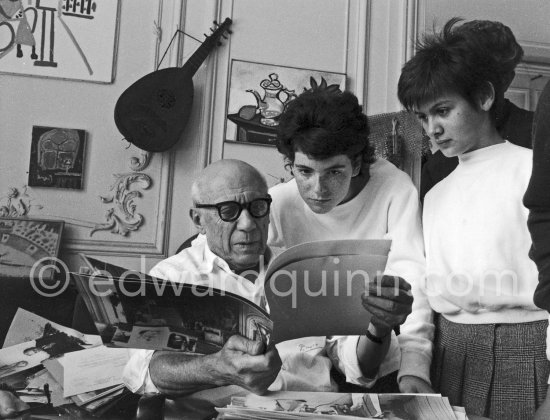 Pablo Picasso, Paloma Picasso and Catherine Hutin viewing photos by ...