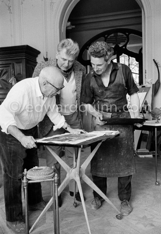 Pablo Picasso and Jacques Frélaut (right), his printer in Vallauris, and the painter Edouard Pignon. At a table by Joseph-Marius Tiola. La Californie, Cannes 1961. - Photo by Edward Quinn