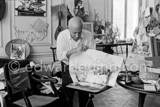 Pablo Picasso working on gouache with Caran d\'ache wax oil pastels and water color. Pablo Picasso always liked surprises and in his work he encouraged unpredictable outcomes. here he has used an old drawing paper due to blot the wet gouache and examines the results with interest. La Californie, Cannes 1961. - Photo by Edward Quinn