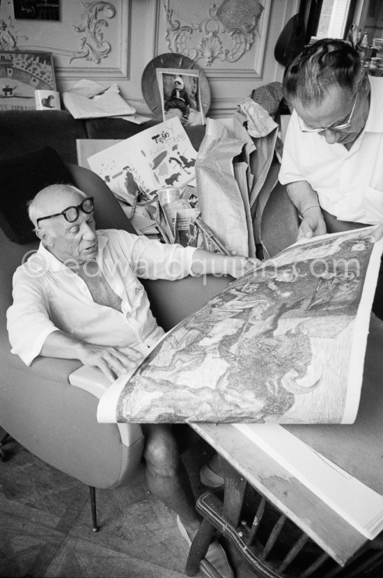 Pablo Picasso and Henri Matarasso, gallery owner and publisher, checking the etching "La Minotauromachie". La Californie, Cannes 1961. - Photo by Edward Quinn