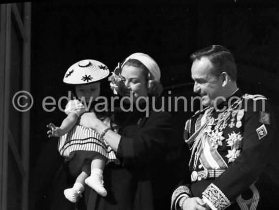 Fête Nationale Monegasque 19.11.57. Princess Grace, Prince Rainier and Princess Caroline at the palace windows. - Photo by Edward Quinn