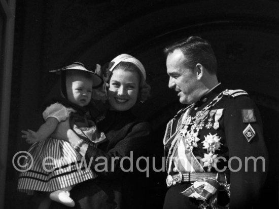 Fête Nationale Monegasque 19.11.57. Princess Grace, Prince Rainier and Princess Caroline at the palace windows. - Photo by Edward Quinn