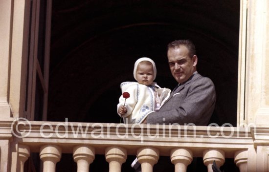 Prince Rainier of Monaco with Princess Caroline at the Palace window, on the day of the Baptism of Prince Albert, in Monaco-Ville, 20th April, 1958. - Photo by Edward Quinn