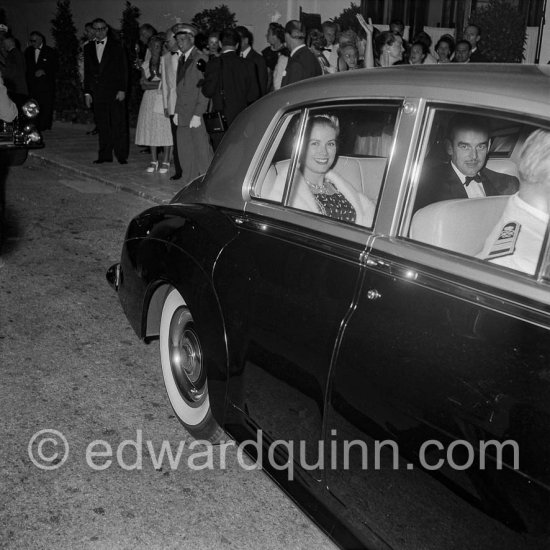 Prince Rainier and Princess Grace of Monaco arriving for the Red Cross Gala. Monte Carlo 1957. Car: 1956 Rolls-Royce Silver Cloud I, #LSXA243, Standard Steel Sports Saloon. Detailed info on this car by expert Klaus-Josef Rossfeldt see About/Additional Infos. (Grace Kelly) - Photo by Edward Quinn