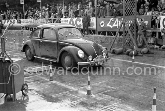 N° 157 H. van der Meulen / M. van der Meulen on Volkswagen undergoing the breaking and starting test. Cars will have to accelerate as fast as possible for 200 metres from a standing start, and then pull up in the shortest possible distance, for the cars have to keep a line between the axles. Rallye Monte Carlo 1951. - Photo by Edward Quinn