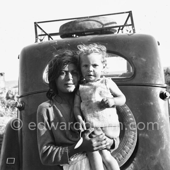 Gypsies on the occasion of the yearly pilgrimage and festival of the Gypsies in honor of Saint Sara, Saintes-Maries-de-la-Mer in 1953. Not identified car. - Photo by Edward Quinn