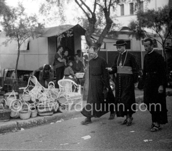 Priests. Gypsies on the occasion of the yearly pilgrimage and festival of the Gypsies in honor of Saint Sara, Saintes-Maries-de-la-Mer in 1953. - Photo by Edward Quinn