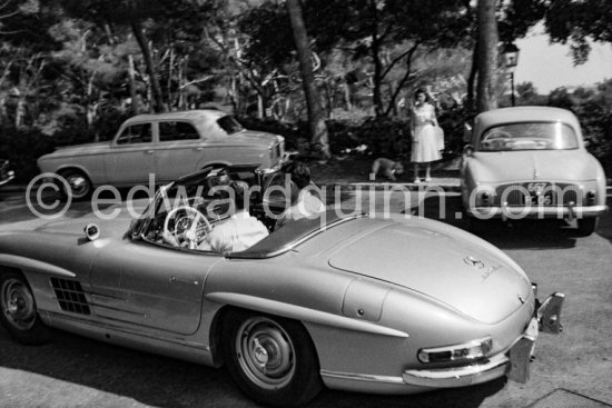 At the wheel Reza Pahlavi, the Shah of Persia. With him his son-in-law Mr. Zahedi. Nice Airport 1958. Car: Mercedes-Benz 300 SL - Photo by Edward Quinn