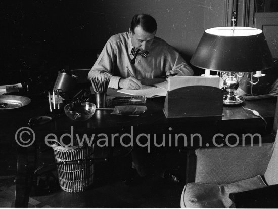 Georges Simenon at his desk. Villa Golden Gate, Cannes 1955. - Photo by Edward Quinn