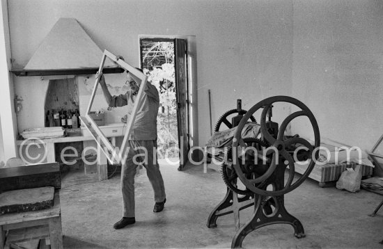 Graham Sutherland and his printing press at La Villa Blanche. Menton 1974. - Photo by Edward Quinn