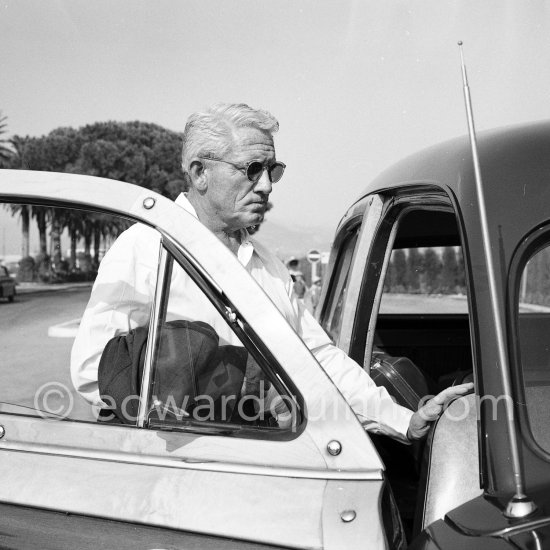 Spencer Tracy was considered an actors\' actor by his admiring colleagues. He came to Nice to sign for a film. Nice 1953. Cars: 1951 Ford Country Squire Woodie Wagon - Photo by Edward Quinn