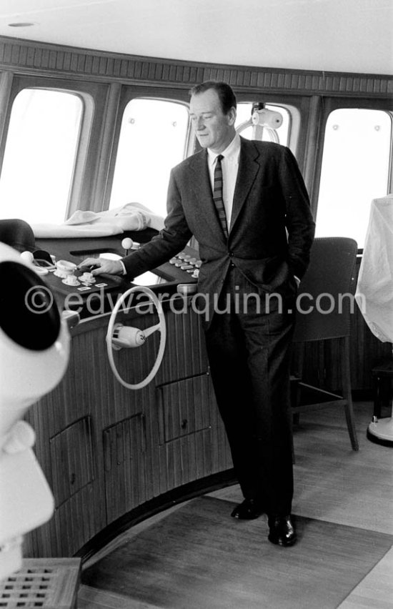 John Wayne on board Onassis\' yacht Christina. Monaco harbor 1957. - Photo by Edward Quinn