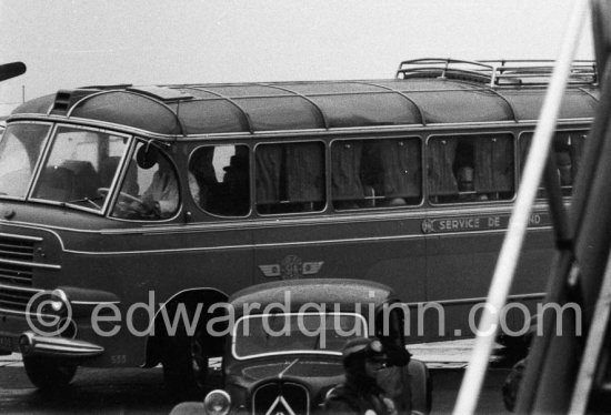 A coach takes over the imperial harem (21 wifes) at the airport which is housed in a wing of the Golf Hotel. Nice Airport 19 - Photo by Edward Quinn