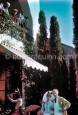 Jean Cocteau, Edouard Dermit, Francine Weisweiller during filming of "Le Testament d’Orphée", film of Jean Cocteau. On the balcony Alberto Magnelli, Pablo Picasso, Renato Guttuso. Saint-Jean-Cap-Ferrat 1959. - Photo by Edward Quinn