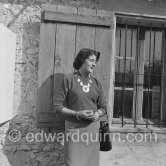 Picasso with Madame Paule de Lazerme (she had an affair with Picasso for some months) who wears a necklace designed by Picasso, made with the help of the Vallauris dentist Dr. Chatagnier. In front of the studio le Fournas, Vallauris 1953. - Photo by Edward Quinn