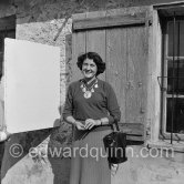 Pablo Picasso with Madame Paule de Lazerme (she had an affair with Pablo Picasso for some months) who wears a necklace designed by Pablo Picasso, made with the help of the Vallauris dentist Dr. Chatagnier. In front of the studio Le Fournas, Vallauris 1953. - Photo by Edward Quinn